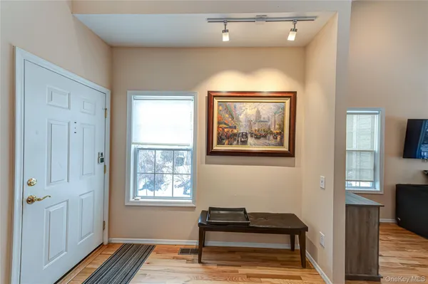 a view of a livingroom with furniture and windows