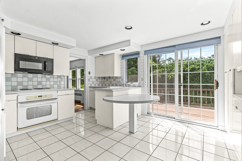 6 Old Colony Road Arlington, MA 02474 - Photo 5 of 15 a kitchen with a sink cabinets and appliances