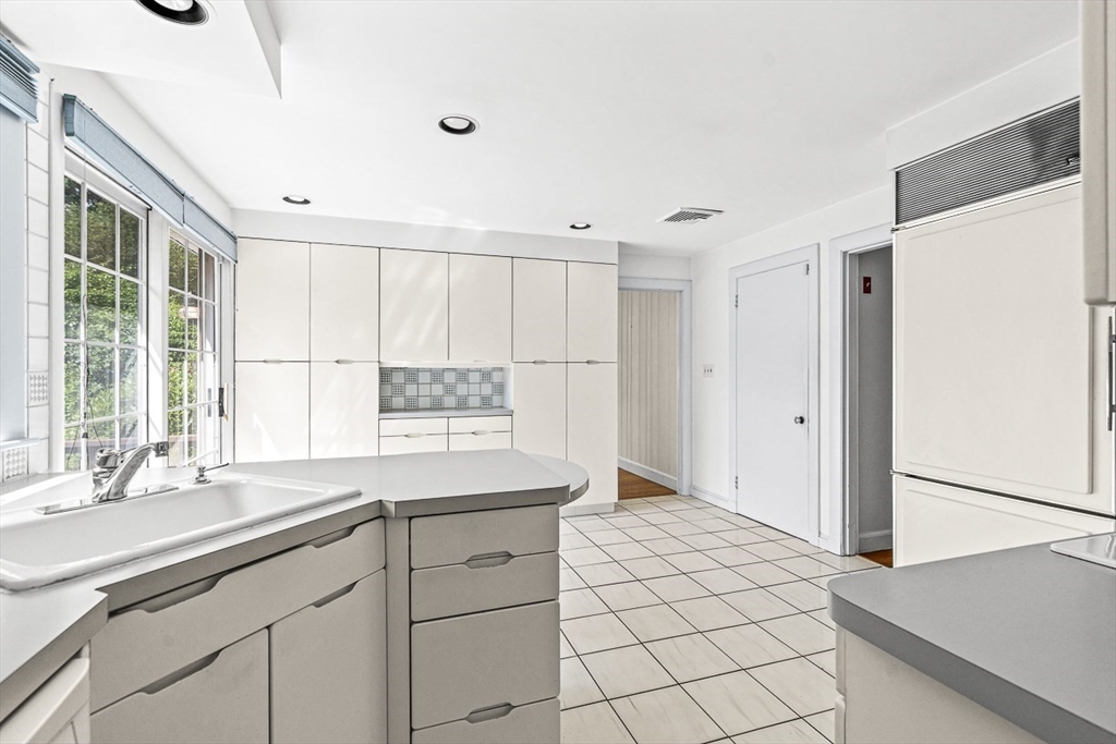 6 Old Colony Road Arlington, MA 02474 - Photo 7 of 15 a kitchen with a sink cabinets and window