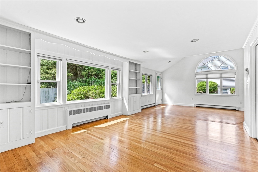 6 Old Colony Road Arlington, MA 02474 - Photo 8 of 15 a view of an empty room with a window and wooden floor