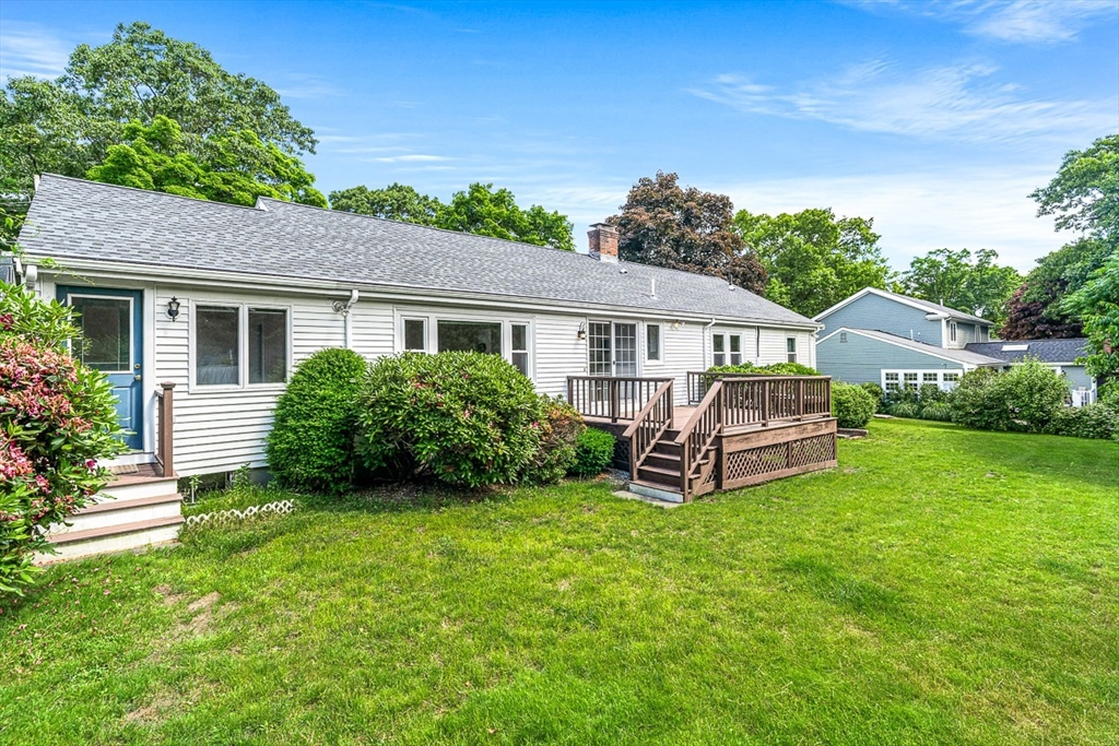 6 Old Colony Road Arlington, MA 02474 - Photo 10 of 15 a view of a house with backyard and a garden