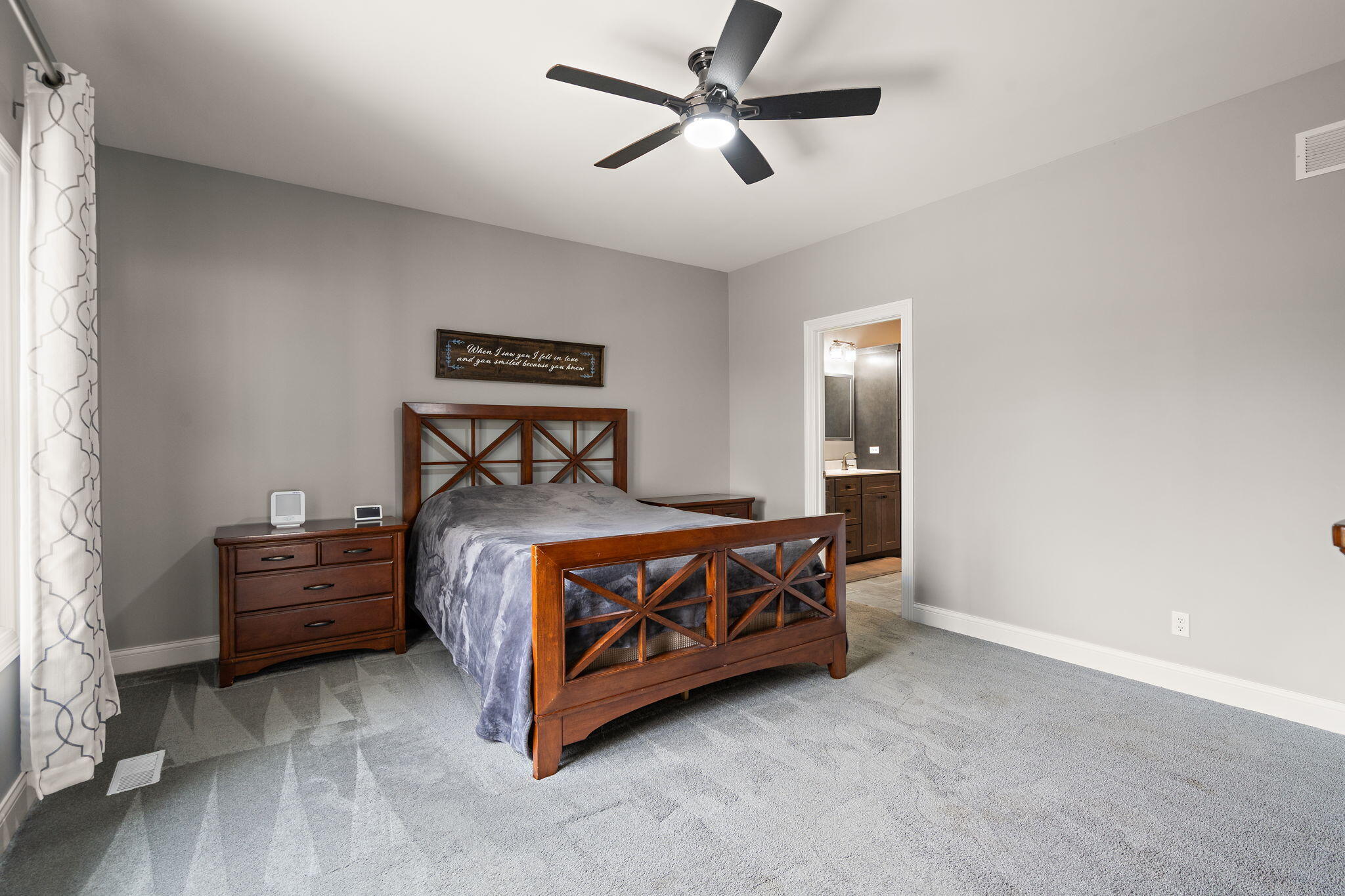 512 West Joliet Street Crown Point, IN 46307 - Photo 20 of 47 a bedroom with a bed and a ceiling fan