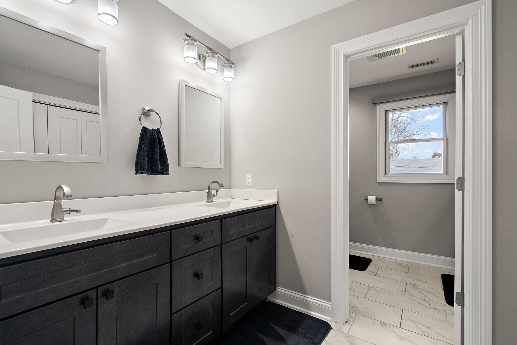 512 West Joliet Street Crown Point, IN 46307 - Photo 30 of 47 a bathroom with a double vanity sink and a mirror