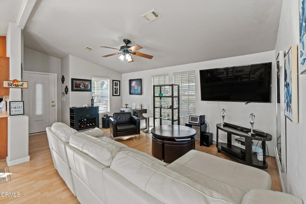 24 Via Rosal, Unit 24 Camarillo, CA 93012 - Photo 11 of 40 a living room with furniture and a flat screen tv