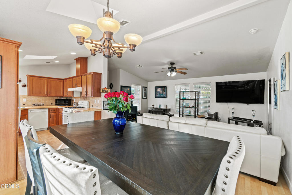 24 Via Rosal, Unit 24 Camarillo, CA 93012 - Photo 14 of 40 a view of a dining room with furniture and a flat screen tv