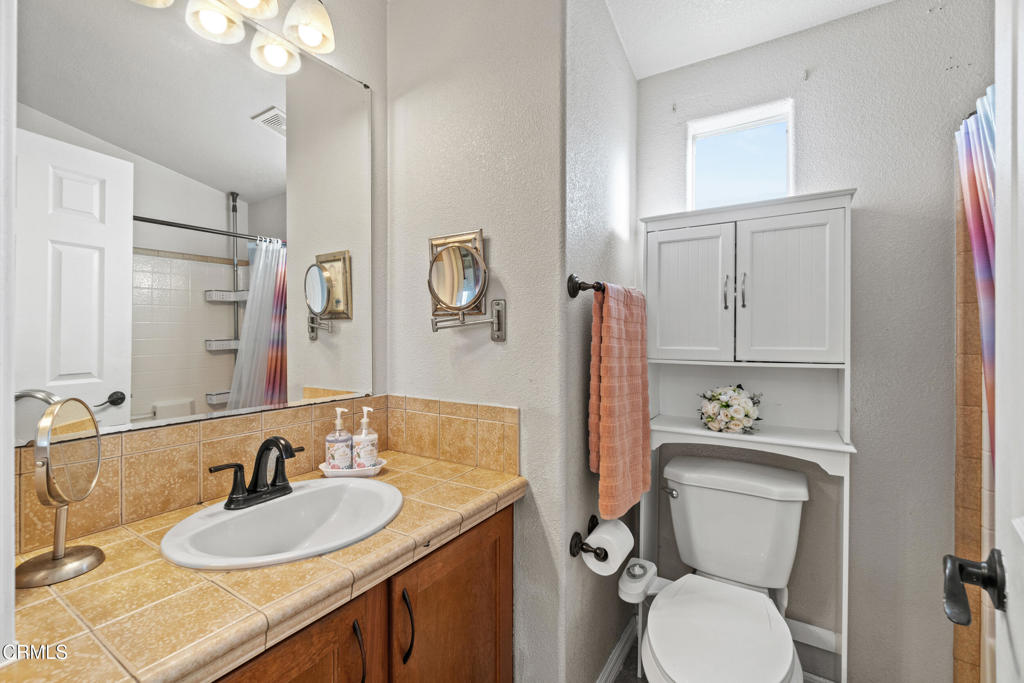 24 Via Rosal, Unit 24 Camarillo, CA 93012 - Photo 19 of 40 a bathroom with a granite countertop toilet sink and mirror