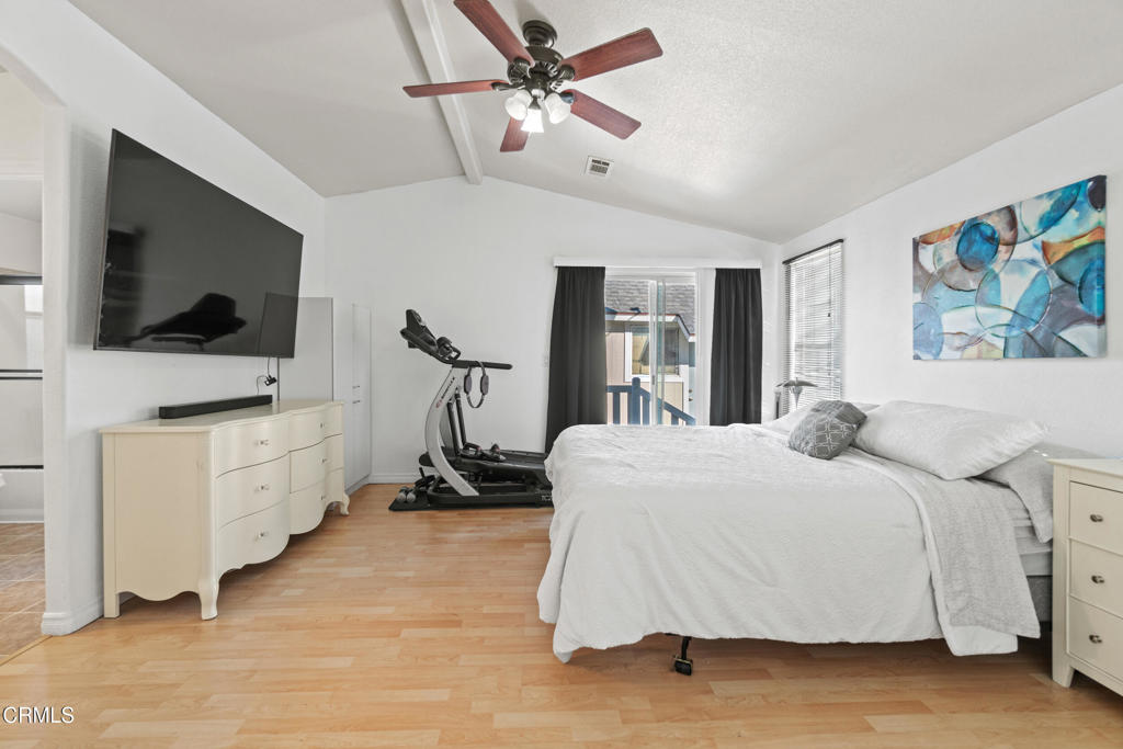 24 Via Rosal, Unit 24 Camarillo, CA 93012 - Photo 25 of 40 a bedroom with a bed and a flat screen tv