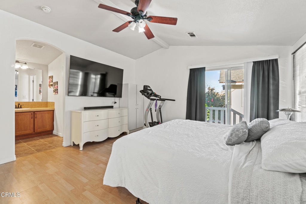 24 Via Rosal, Unit 24 Camarillo, CA 93012 - Photo 27 of 40 a bedroom with a bed flat screen tv and a couch