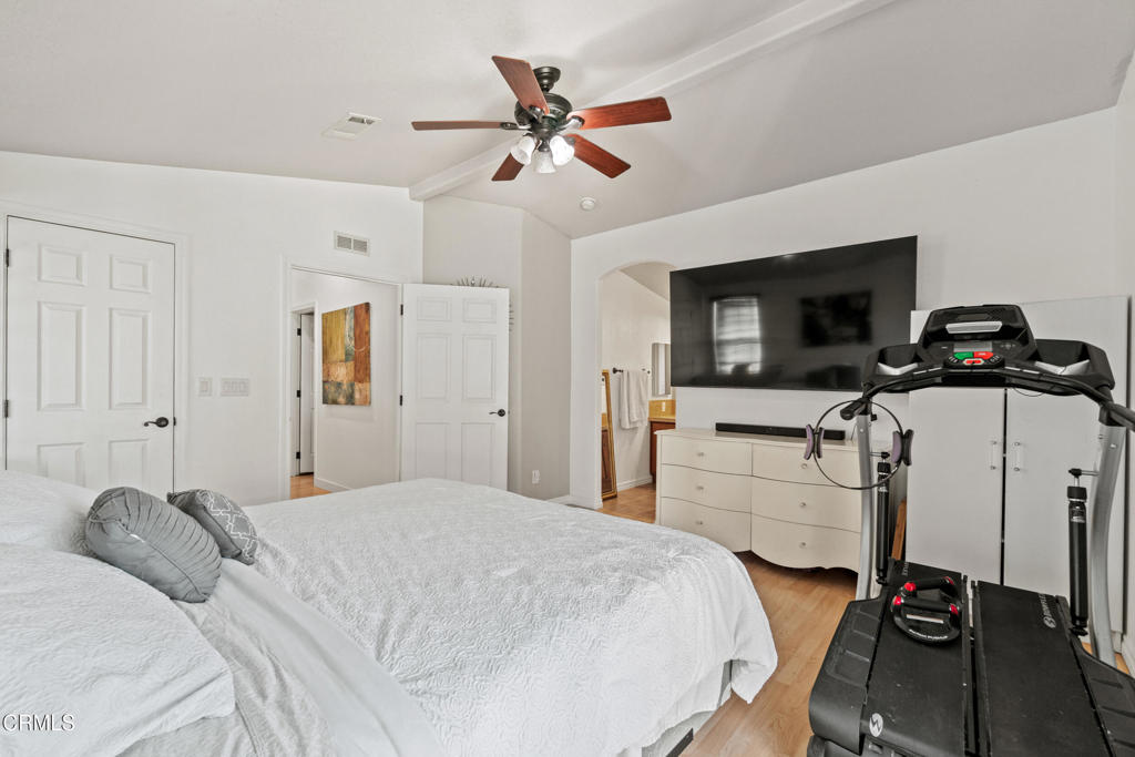 24 Via Rosal, Unit 24 Camarillo, CA 93012 - Photo 28 of 40 a bedroom with a bed and a flat screen tv
