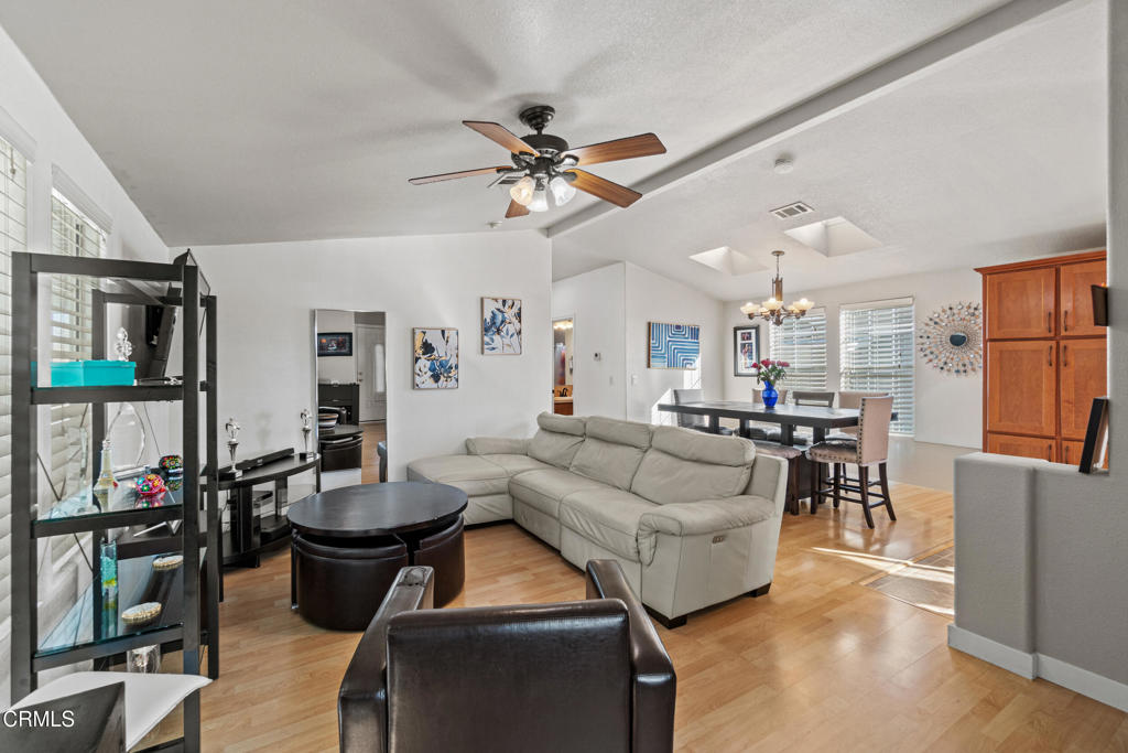 24 Via Rosal, Unit 24 Camarillo, CA 93012 - Photo 9 of 40 a living room with furniture a flat screen tv and a table
