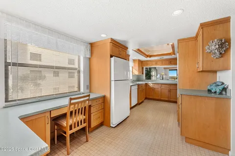 a bedroom with a large bed and a dresser