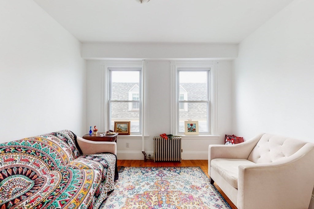 26 Clark Street Somerville, MA 02143 - Photo 12 of 32 a bedroom with furniture and a window
