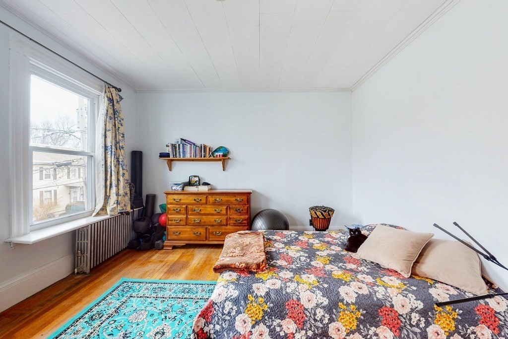 26 Clark Street Somerville, MA 02143 - Photo 13 of 32 a bedroom with bed and window