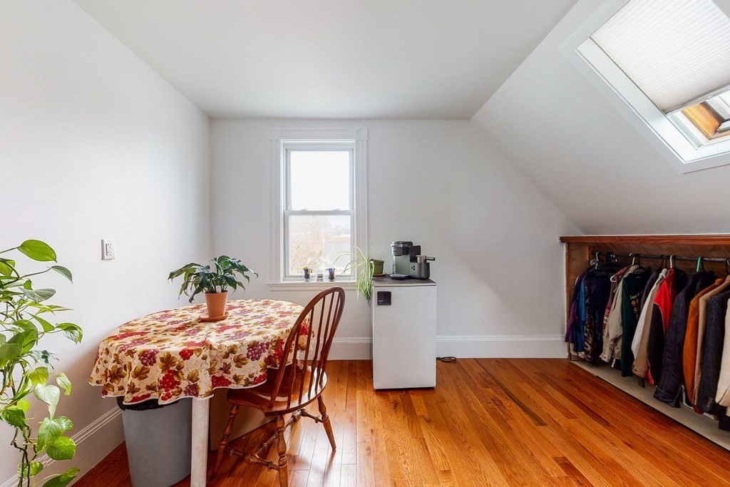 26 Clark Street Somerville, MA 02143 - Photo 20 of 32 a view of a dining room with furniture and wooden floor