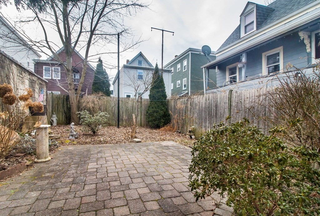 26 Clark Street Somerville, MA 02143 - Photo 25 of 32 a view of a house with a yard and pathway