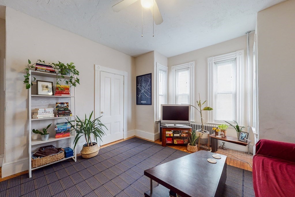 26 Clark Street Somerville, MA 02143 - Photo 4 of 32 a living room with furniture and a flat screen tv