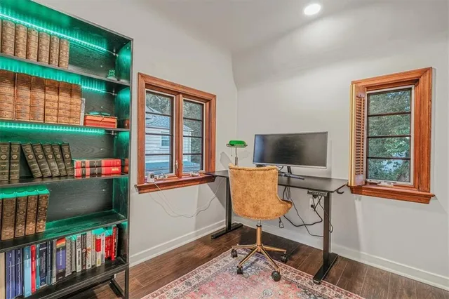 a living room with fireplace furniture and a book shelf
