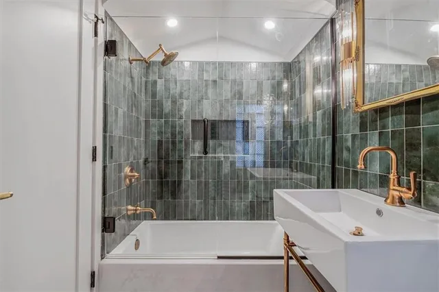 a bathroom with a bathtub and a shower