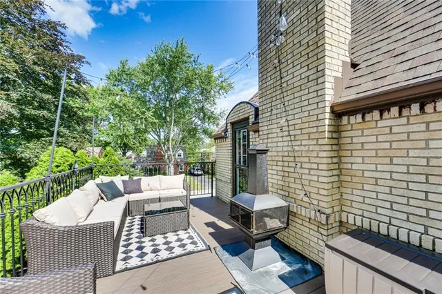 a view of a patio with a table and chairs