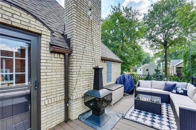 a view of balcony with couch and chairs