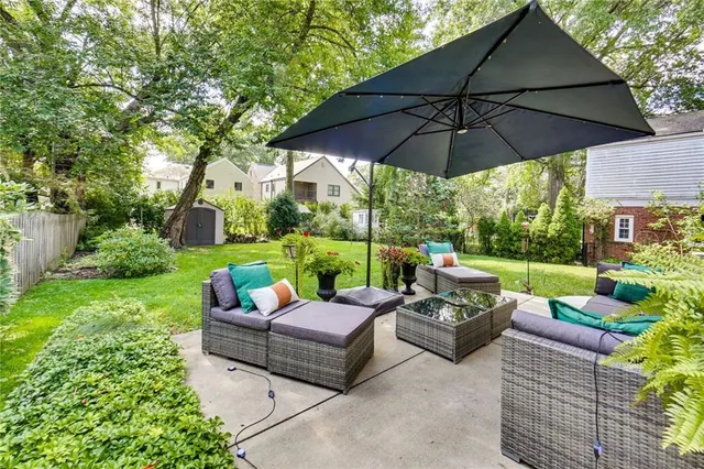 a view of a table and chairs under an umbrella