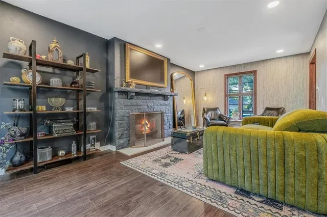 a living room with furniture and a fireplace