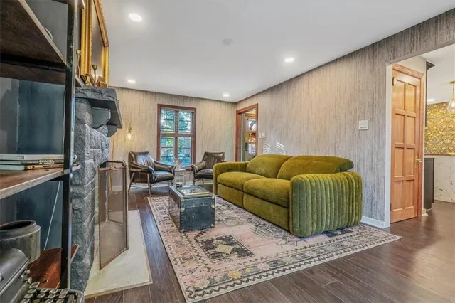 a living room with furniture and a rug