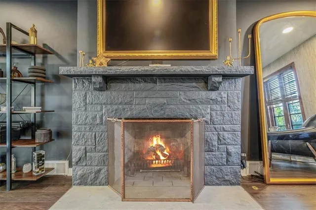 a fireplace with a chair and a fireplace