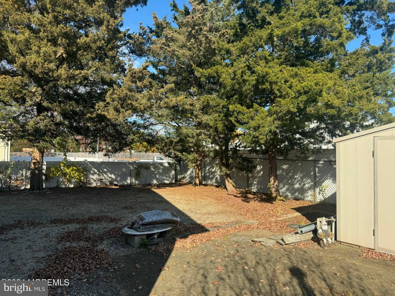 16 Mandalay Road Brick, NJ 08723 - Photo 13 of 22 a view of a yard with table and chairs