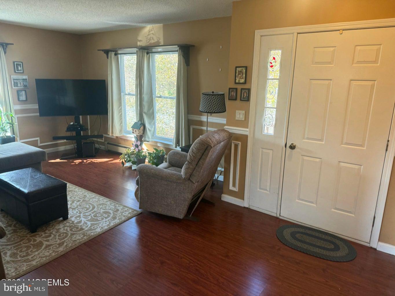 16 Mandalay Road Brick, NJ 08723 - Photo 4 of 22 a living room with furniture and a flat screen tv