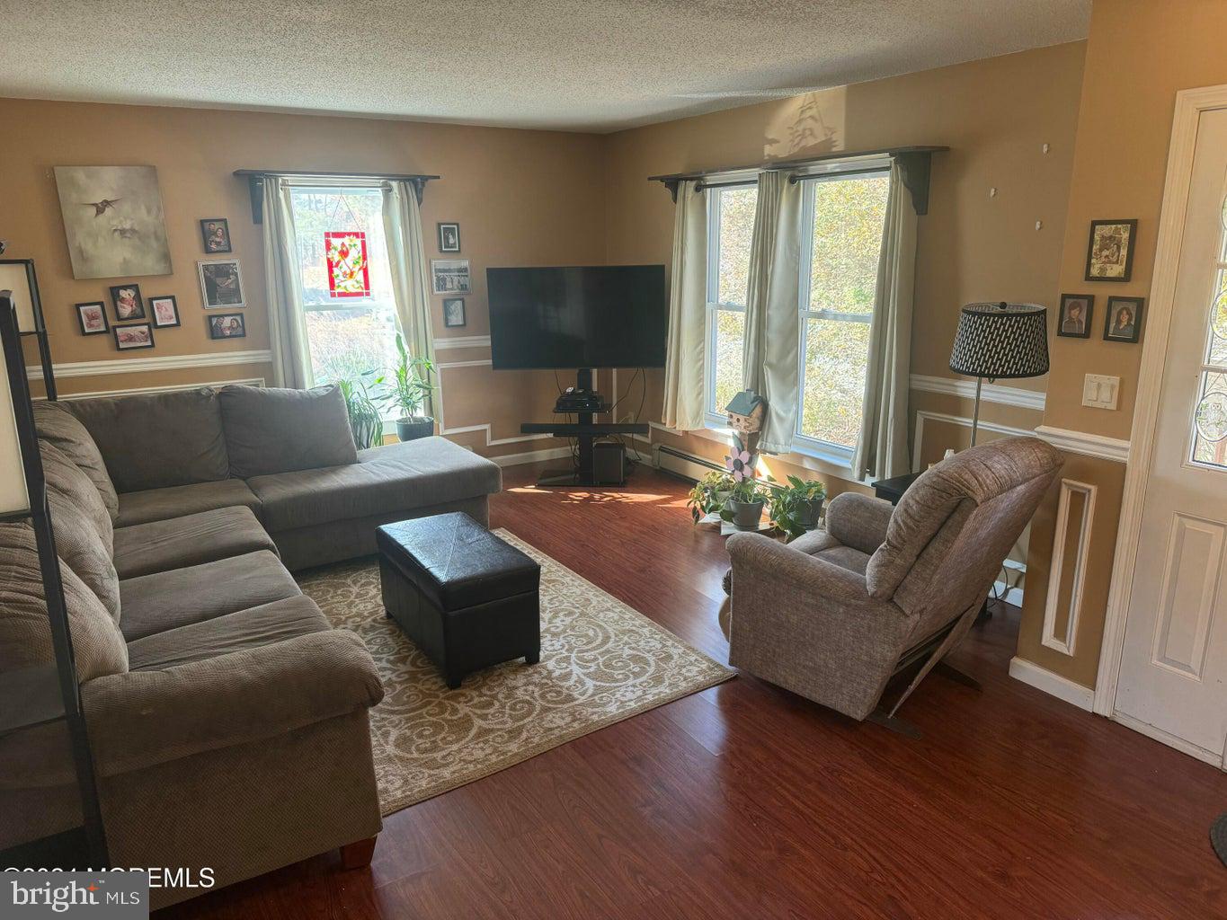 16 Mandalay Road Brick, NJ 08723 - Photo 5 of 22 a living room with furniture wooden floor and a flat screen tv