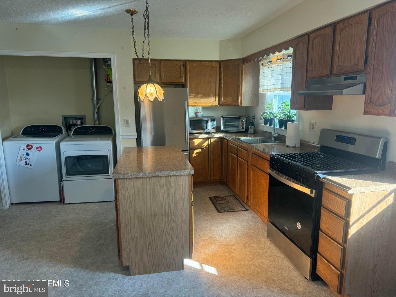 16 Mandalay Road Brick, NJ 08723 - Photo 6 of 22 a kitchen with granite countertop a sink a stove and refrigerator