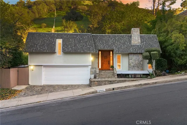 front view of a house with a street