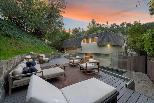 a terrace of a house with outdoor seating