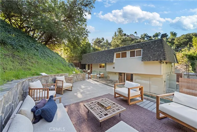 a view of a patio with a table and chairs