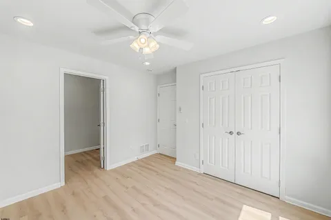 an empty room with wooden floor