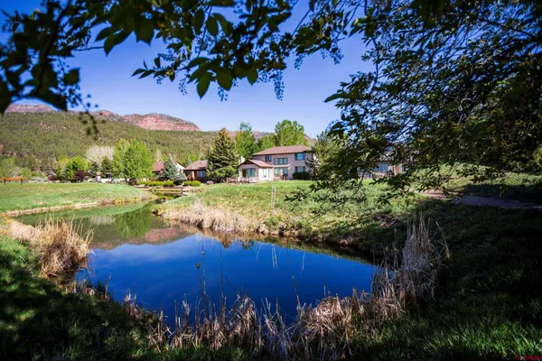 a view of a lake with a yard