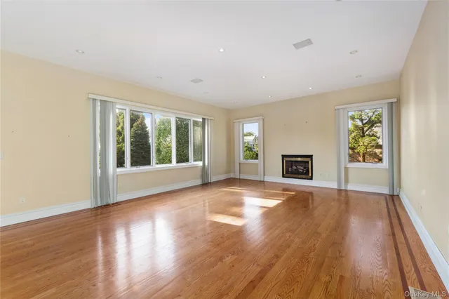 a bathroom with a tub a sink and glass door shower