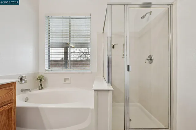 a white bath tub sitting next to a white sink