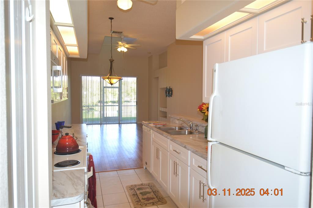204 Hemingway Drive Oldsmar, FL 34677 - Photo 14 of 35 a hallway with a large window and sitting area