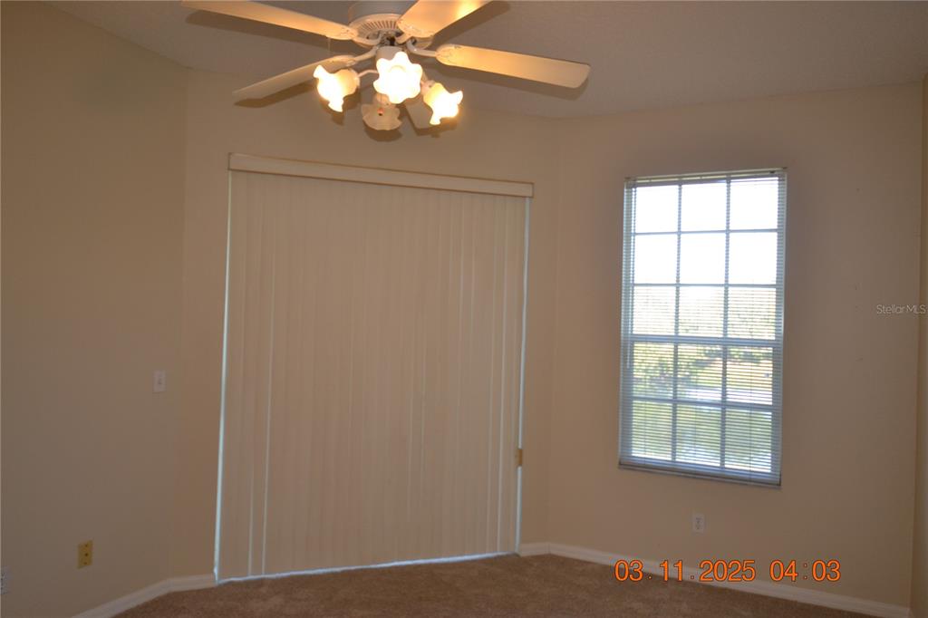 204 Hemingway Drive Oldsmar, FL 34677 - Photo 20 of 35 an empty room with windows and fan