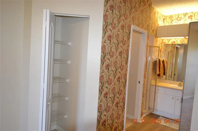 a bathroom with a shower and a sink