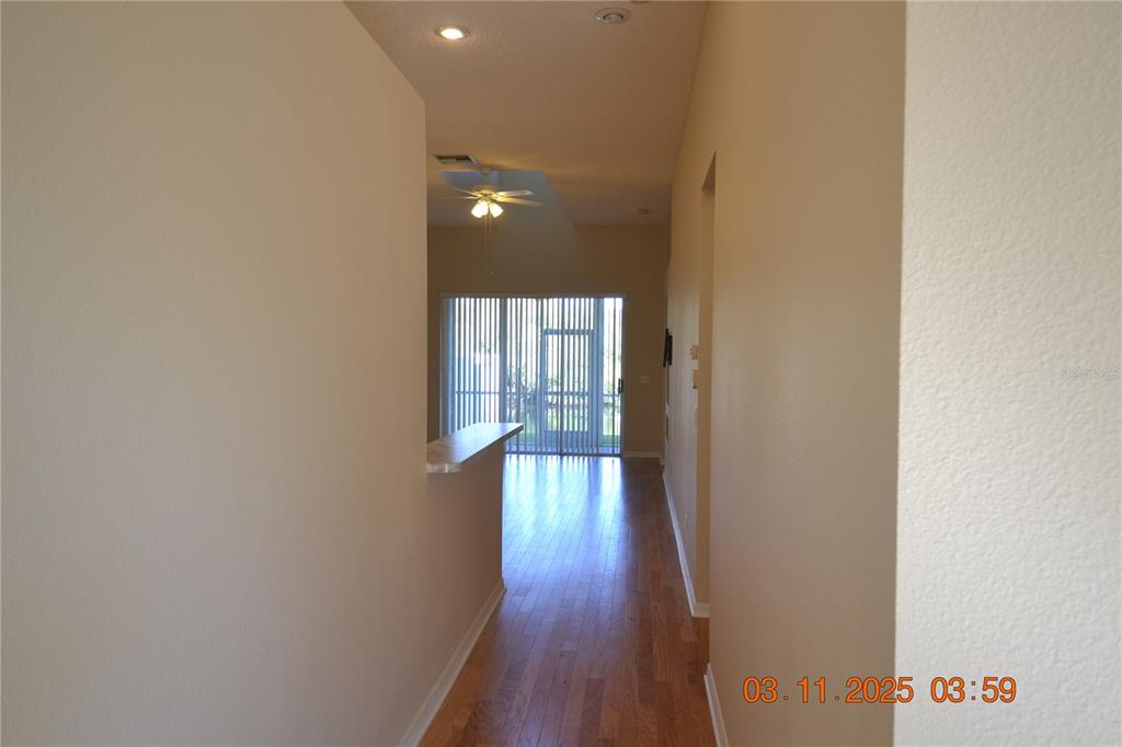 204 Hemingway Drive Oldsmar, FL 34677 - Photo 5 of 35 a view of a hallway with wooden floor