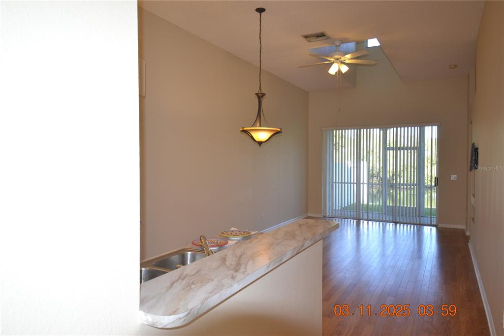 204 Hemingway Drive Oldsmar, FL 34677 - Photo 6 of 35 a view of a room with wooden floor