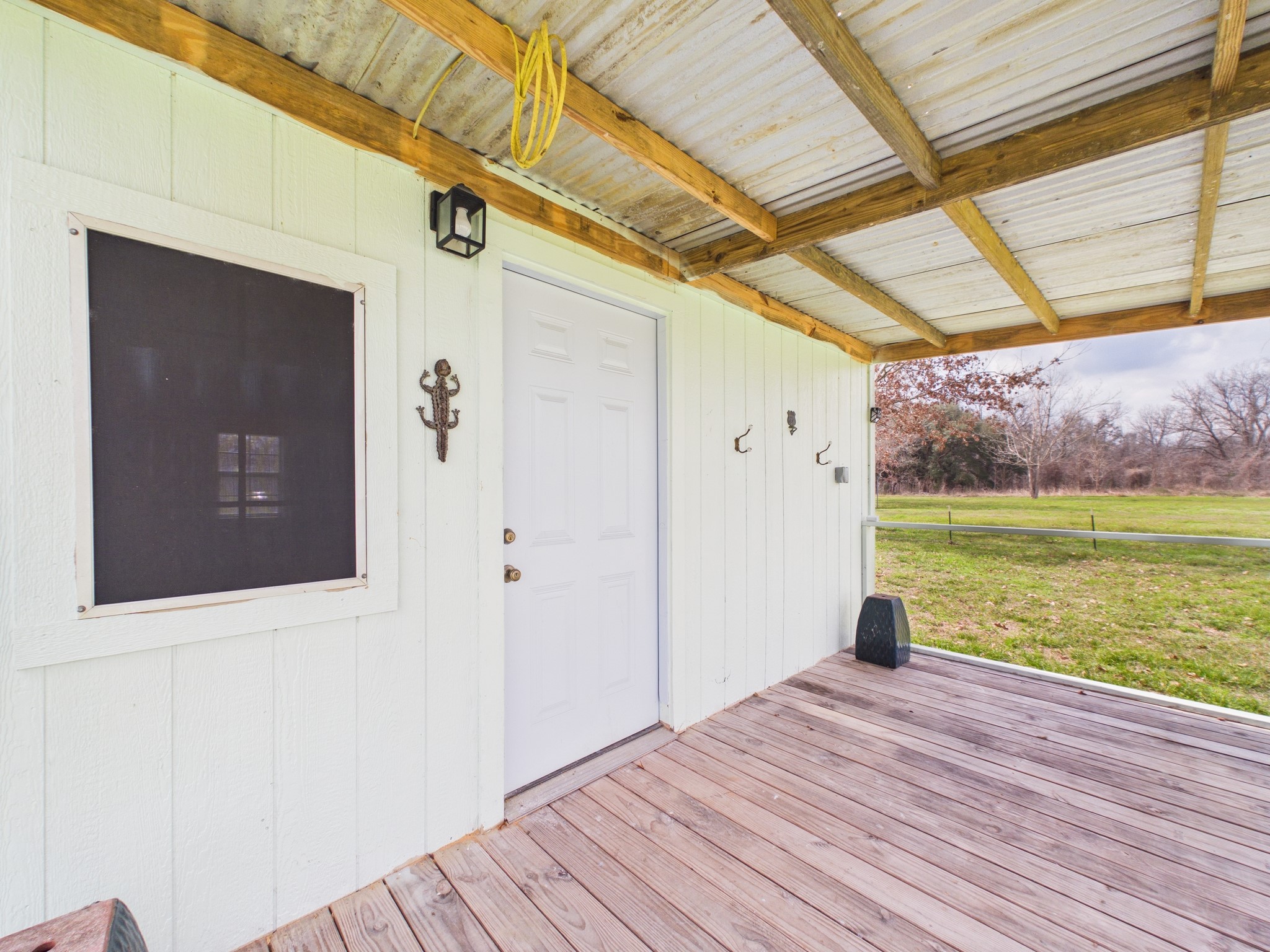 282 B Rte 66 Livingston, TX 77351 - Photo 8 of 25 a view of a porch with wooden floor and garden