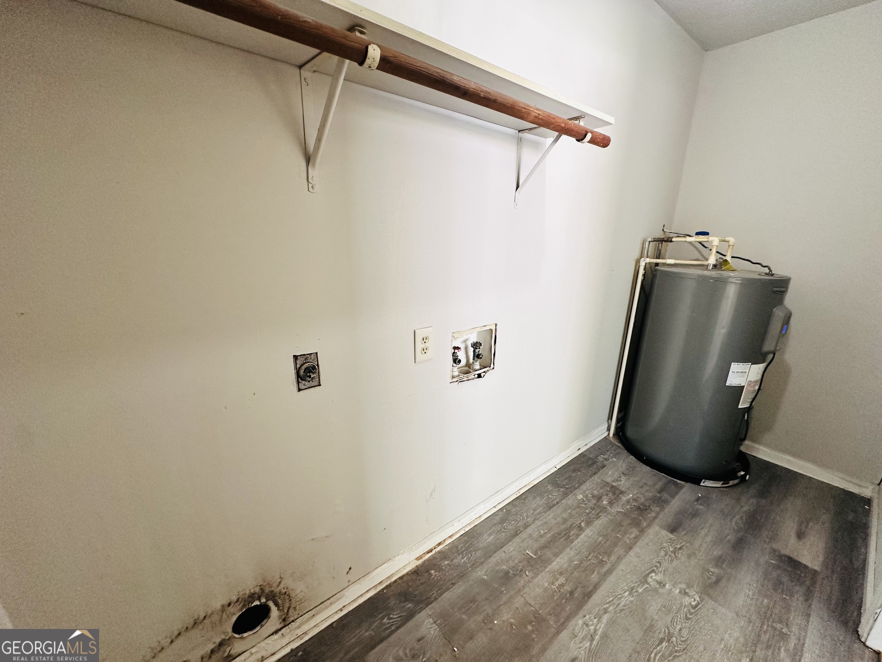 514 South Broad Street Toccoa, GA 30577 - Photo 22 of 22 a view of a storage and utility room with a wooden floor