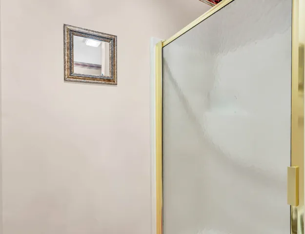 a view of a dining room with furniture and a chandelier