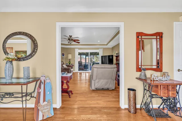 a living room filled with furniture and a wooden floor