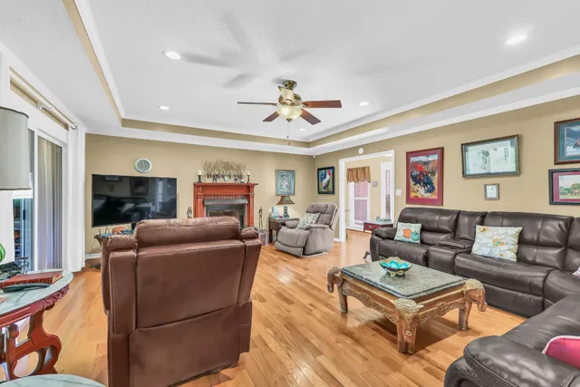 a living room with furniture and a fireplace