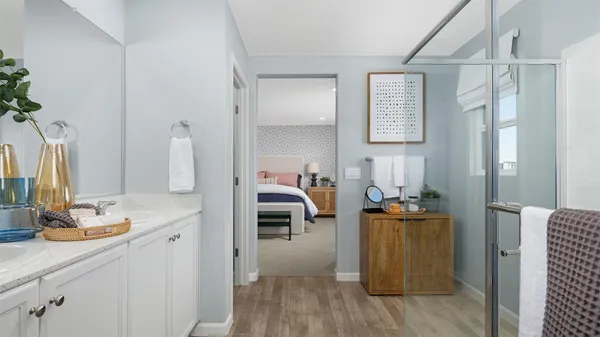 a bedroom with a bed and a mirror